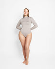 Sara Seamless Long-Sleeve Mock Neck Bodysuit – White Stretch Fit