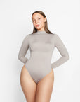 Sara Seamless Long-Sleeve Mock Neck Bodysuit – White Stretch Fit